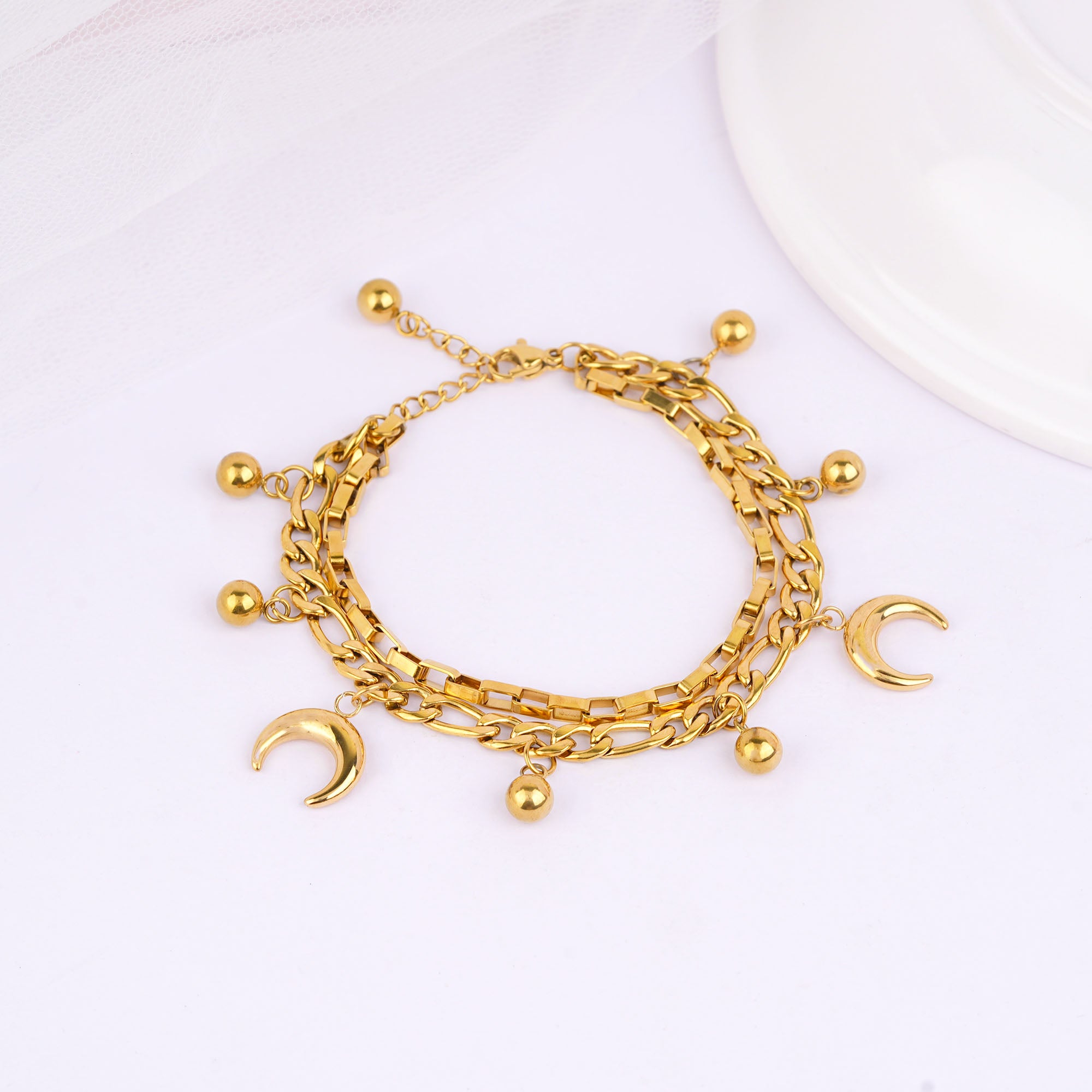 Close-up of moon and star charms