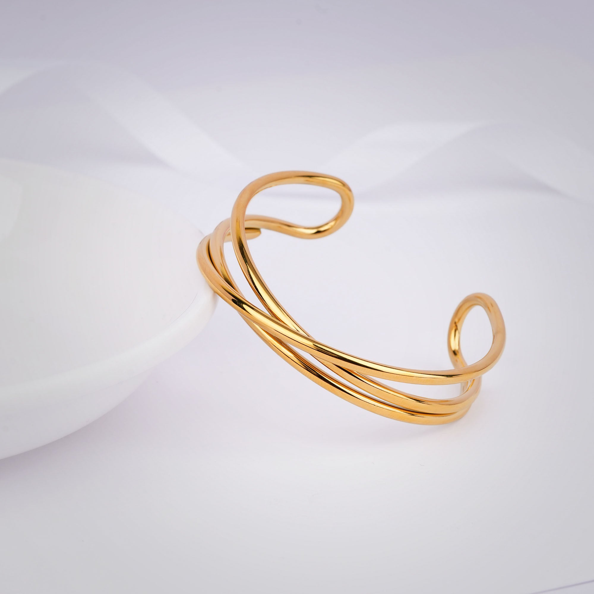 Gold bracelet on a white background