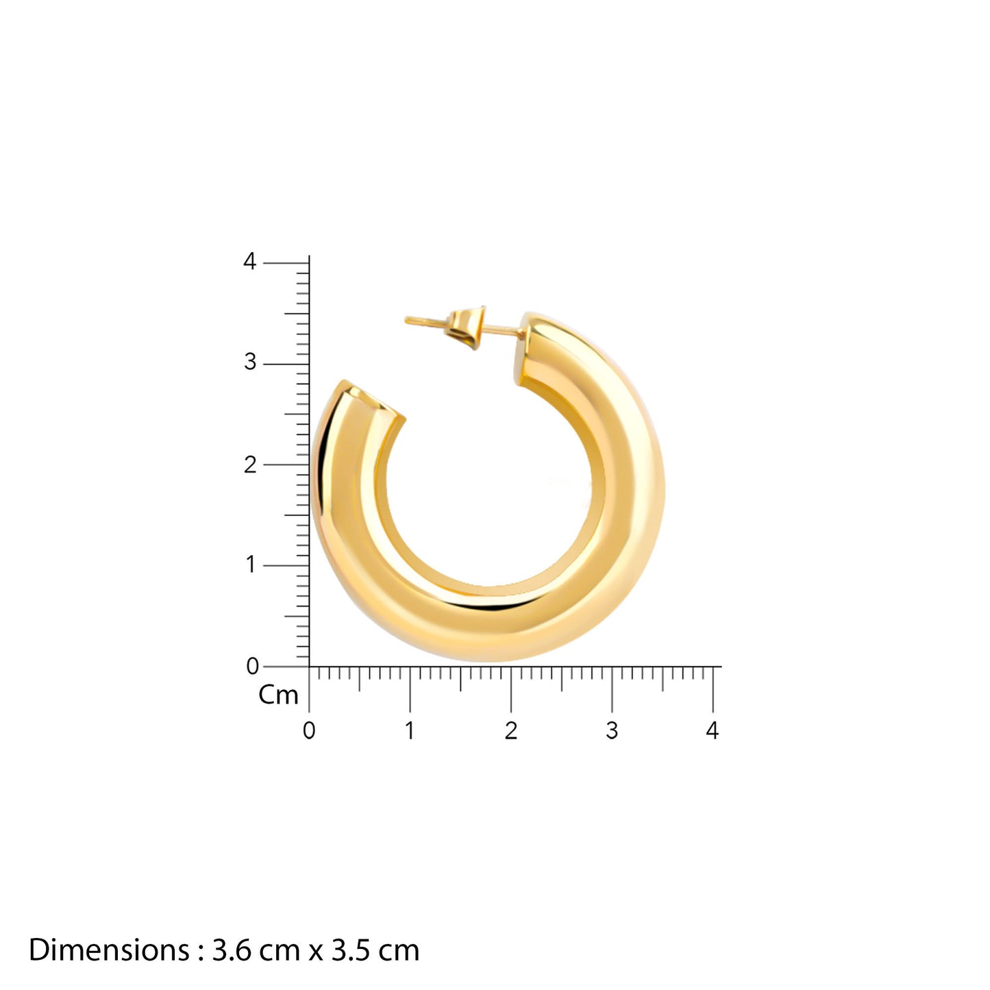 Gold hoop earring with a ruler for scale on a white background