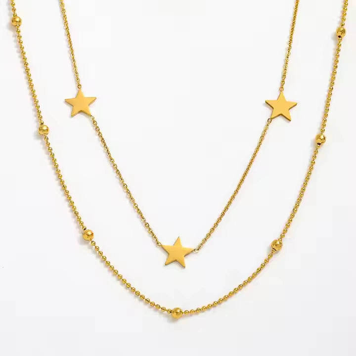 Gold layered necklace with star charms