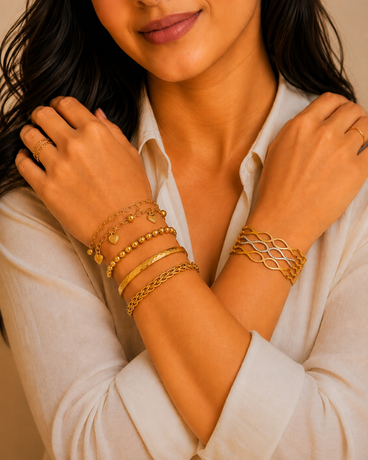 Model wearing 18K Gold plated chain, charm and cuff bracelets. Demifine waterproof and anti-tarnish bracelets