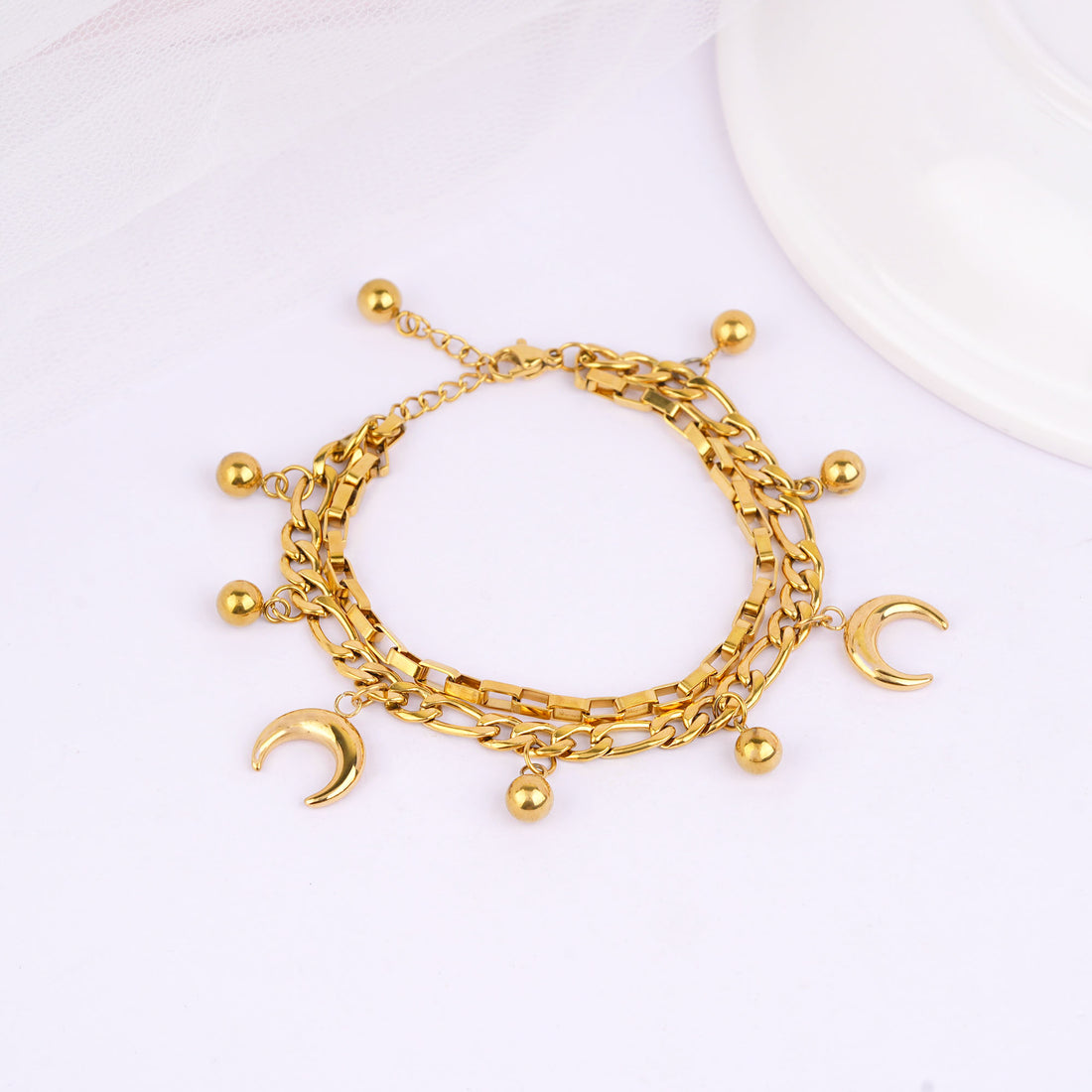 Close-up of moon and star charms