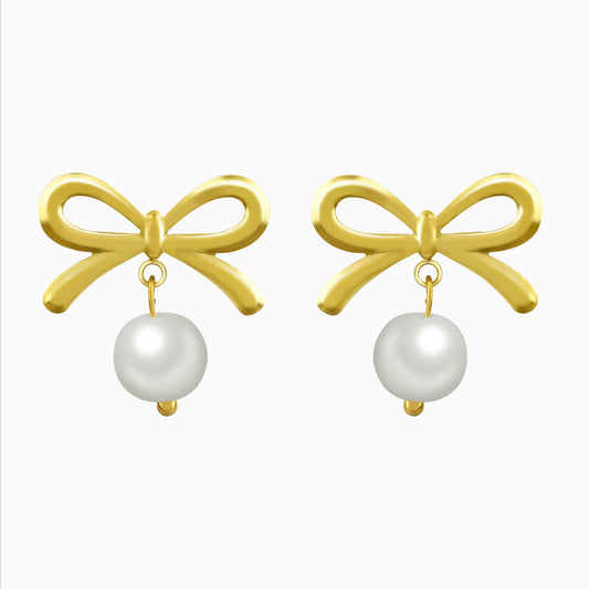 Gold bow-shaped earrings with white pearl drops on a white background