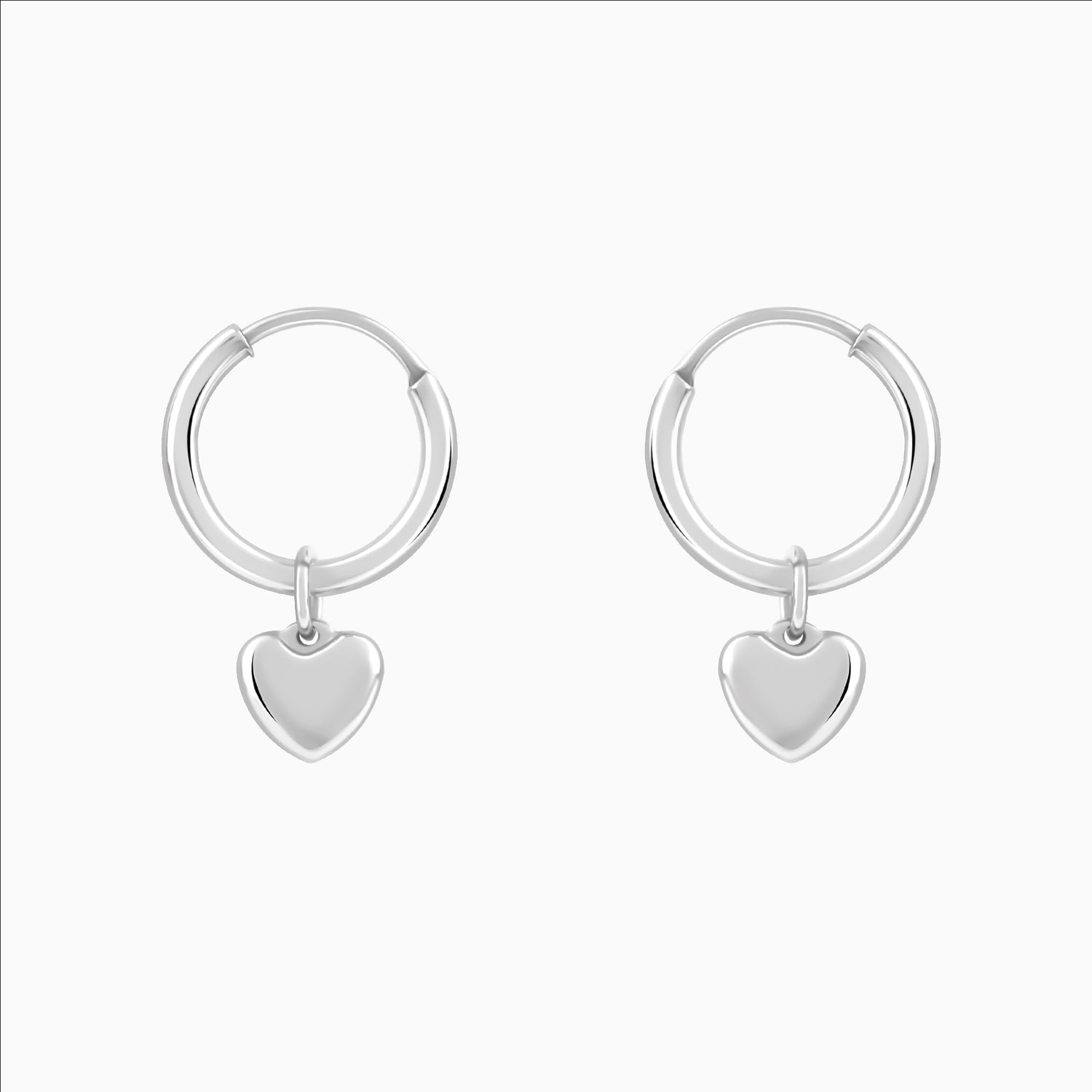Silver hoop earrings with heart charm drops