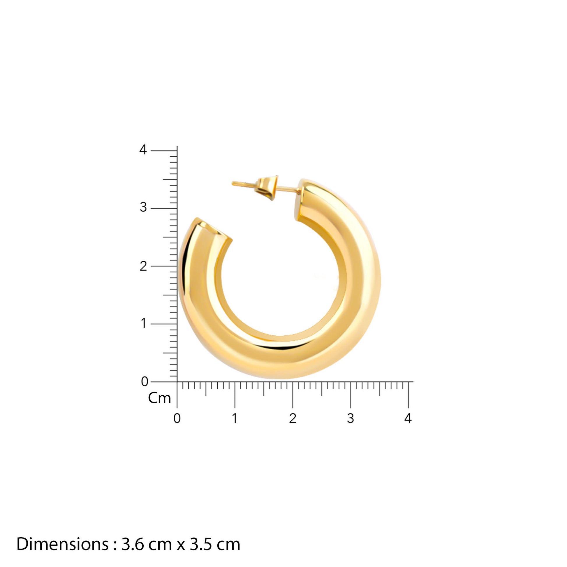 Gold hoop earring with a ruler for scale on a white background