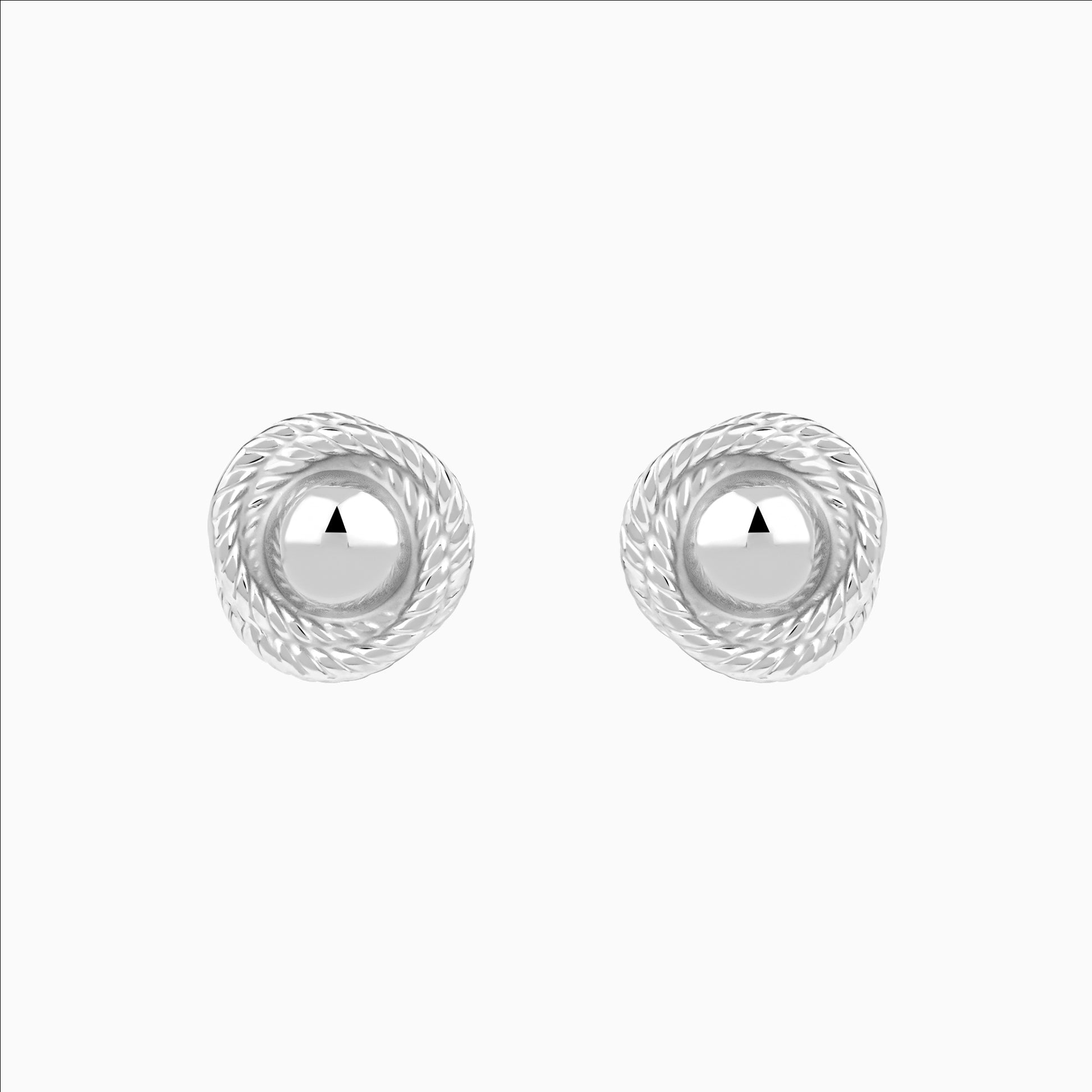 Pair of silver earrings with a white background