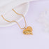Close-up of textured gold heart charm necklace