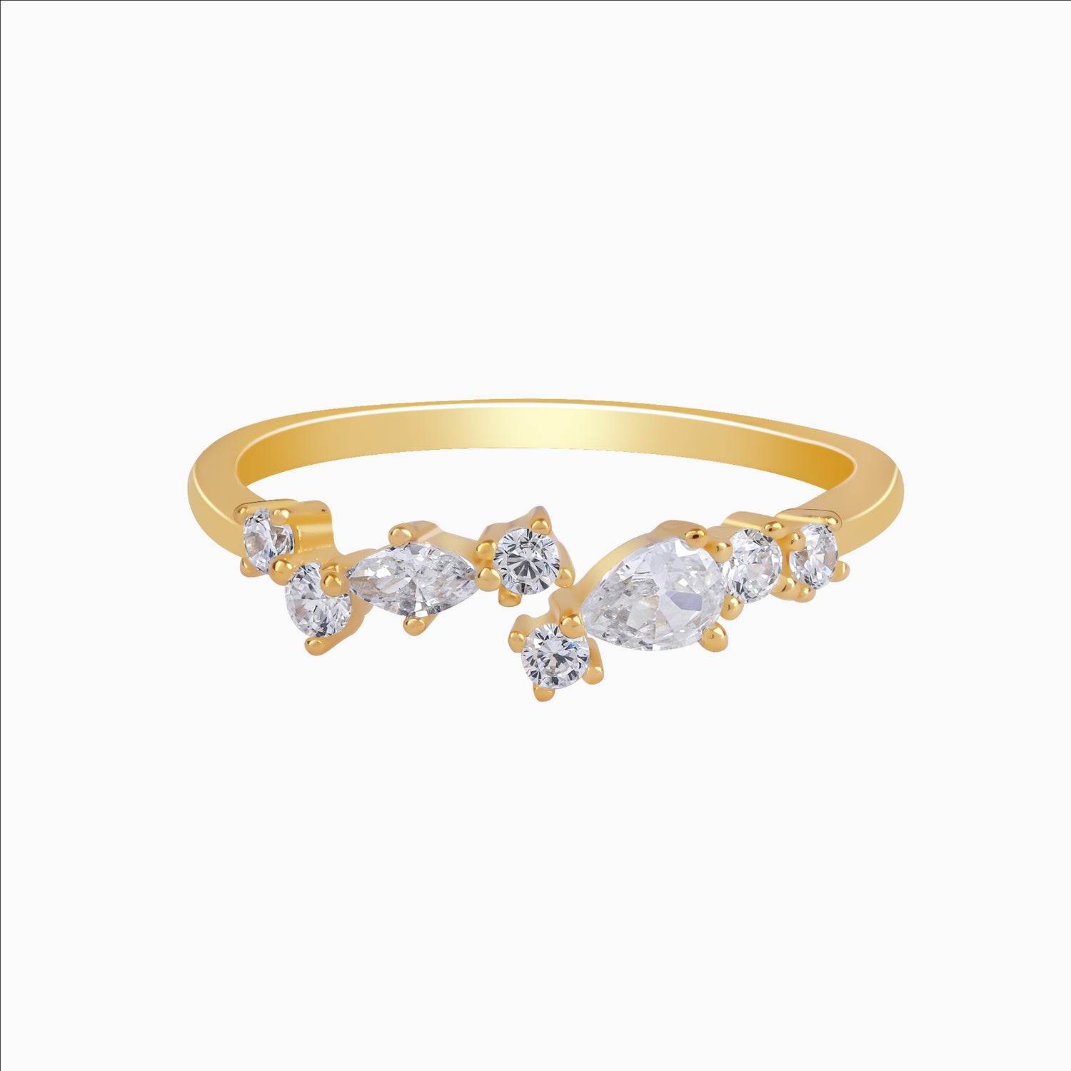 Gold ring with clear gemstones on a white background