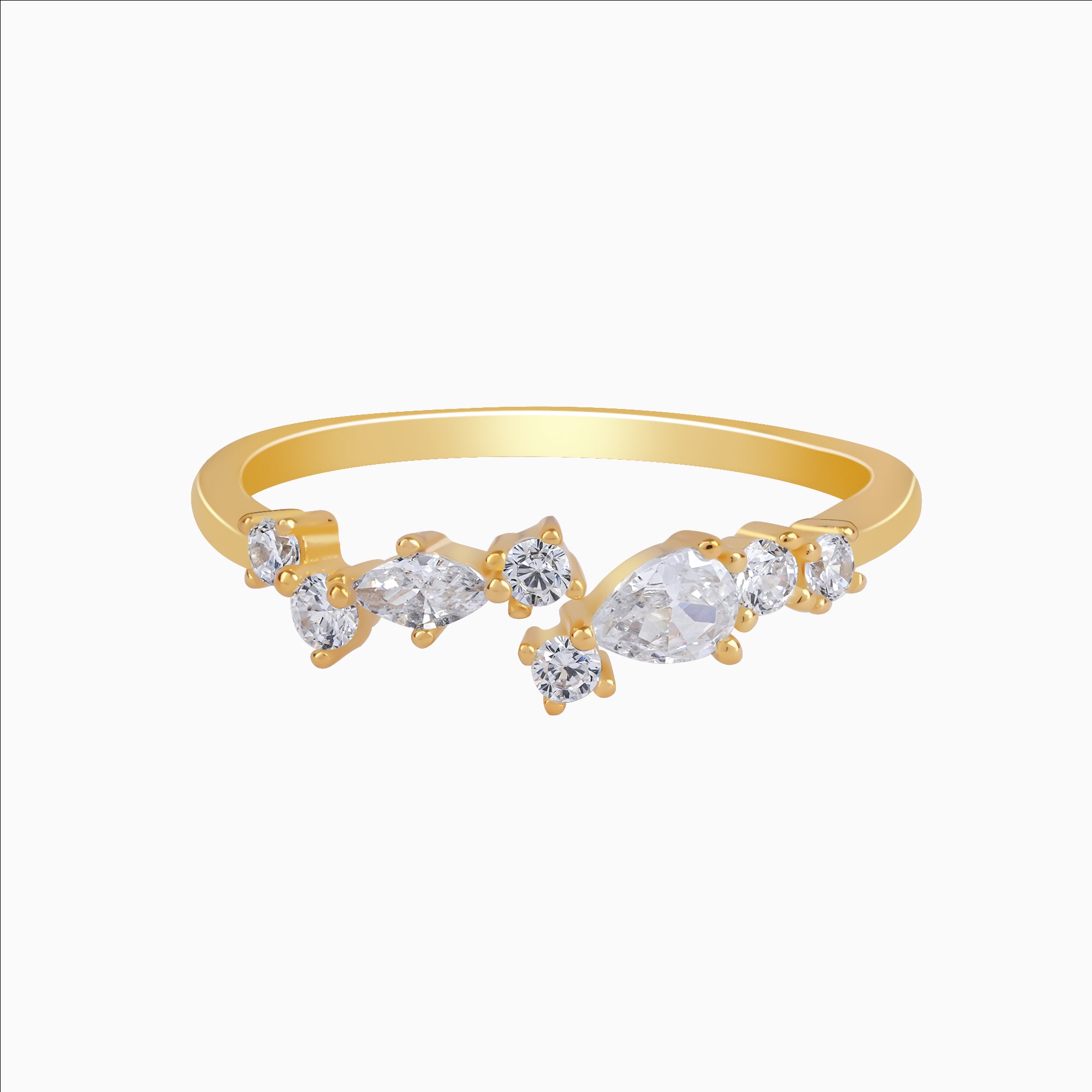 Gold ring with clear gemstones on a white background
