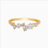 Gold ring with clear gemstones on a white background